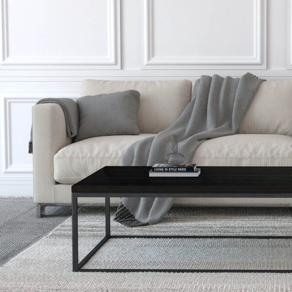 handmade black coffee table with cream sofa in the background